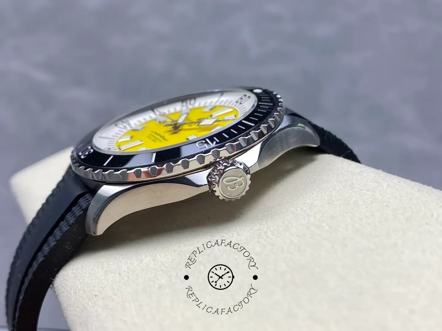 Side view of Breitling Superocean A17375211I1S1 yellow dial showing crown and case.