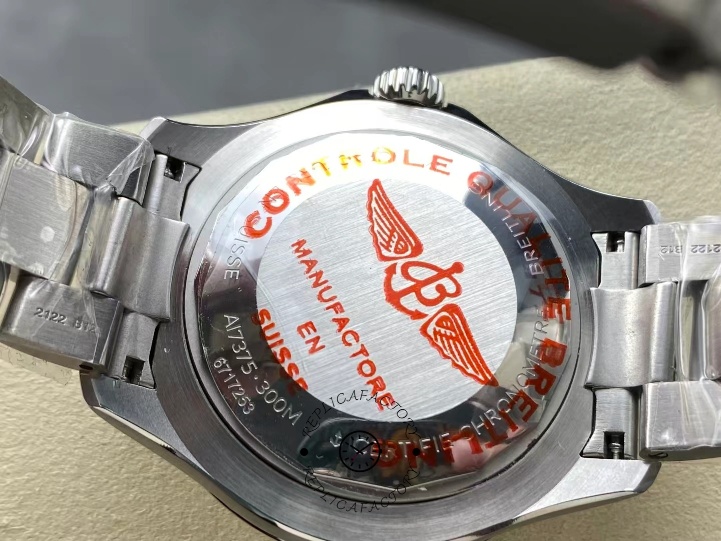 Caseback of Breitling Superocean 42 A17375211I1A1 with red logo engraving.