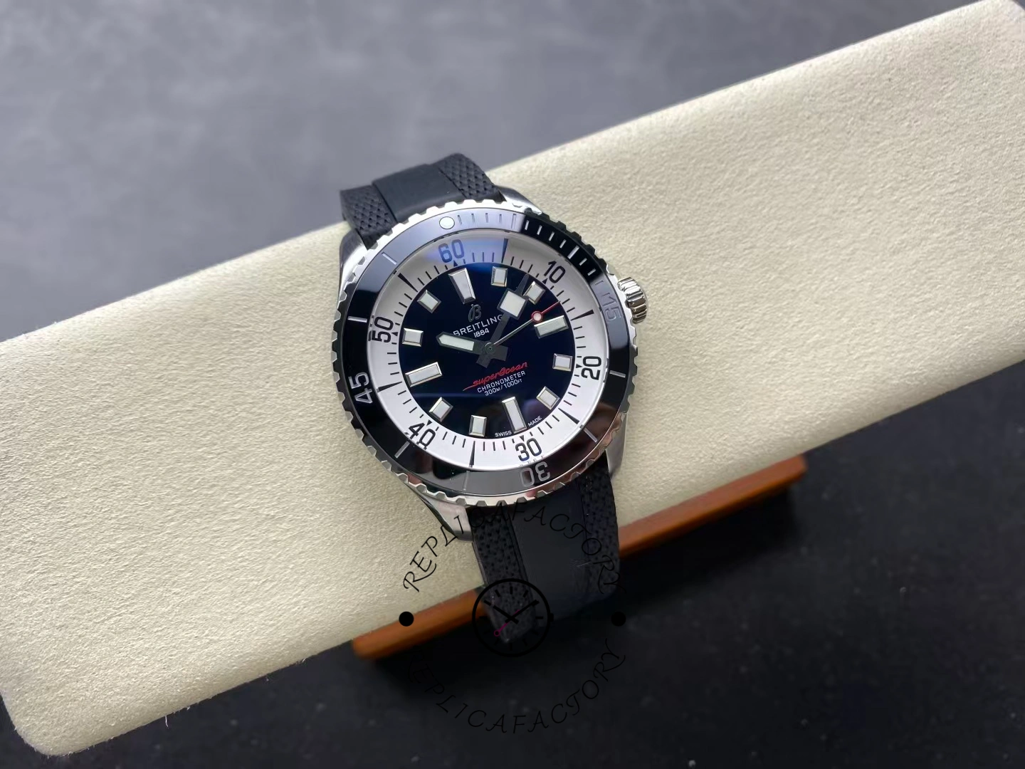 Angled view of Breitling Superocean 44 A17376211B1S1 black dial dive watch with rubber strap.