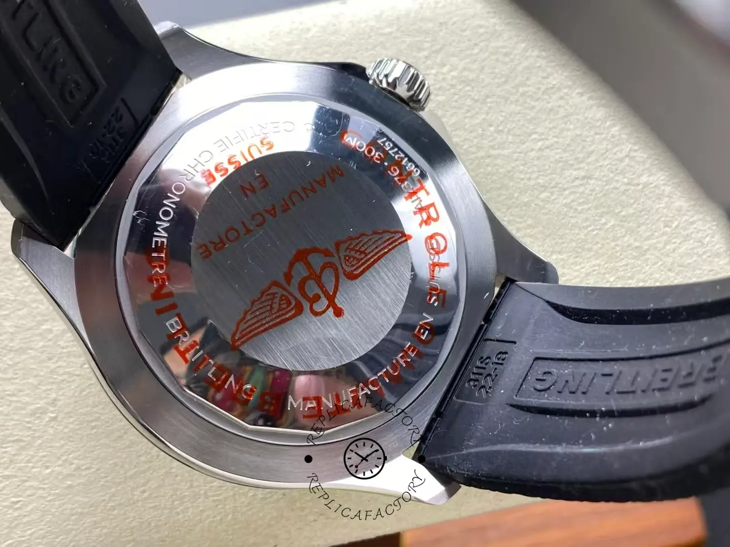 Caseback of Breitling Superocean 44 A17376211L2S1 with red Breitling wing logo.