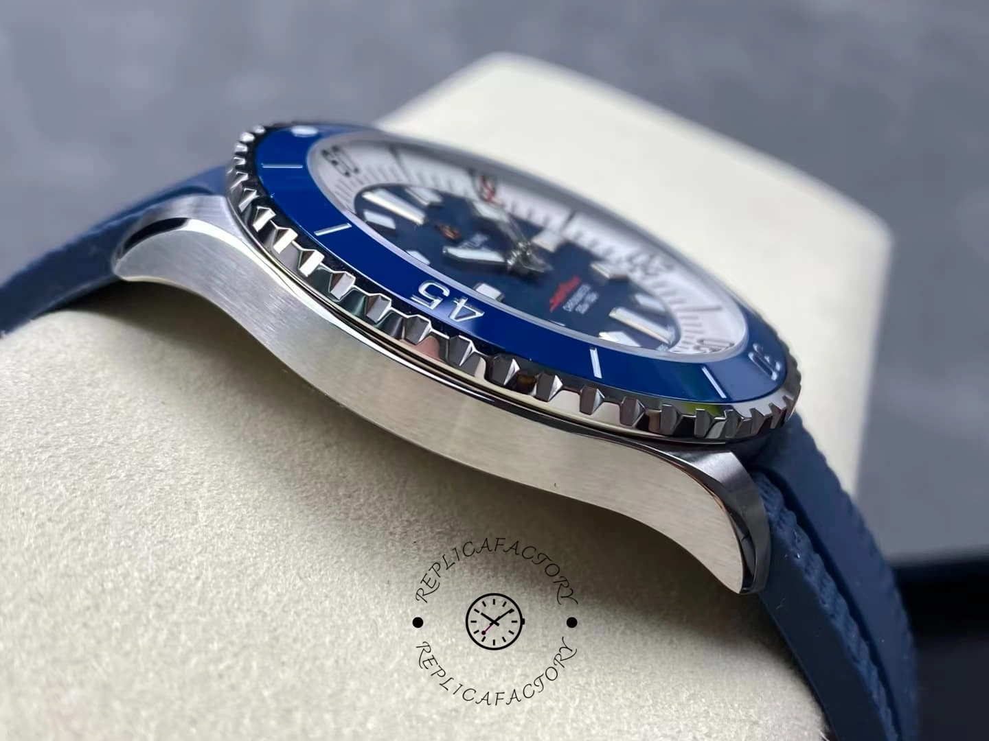 Left side of Breitling Superocean A17375E71C1S1 brushed case and blue bezel.