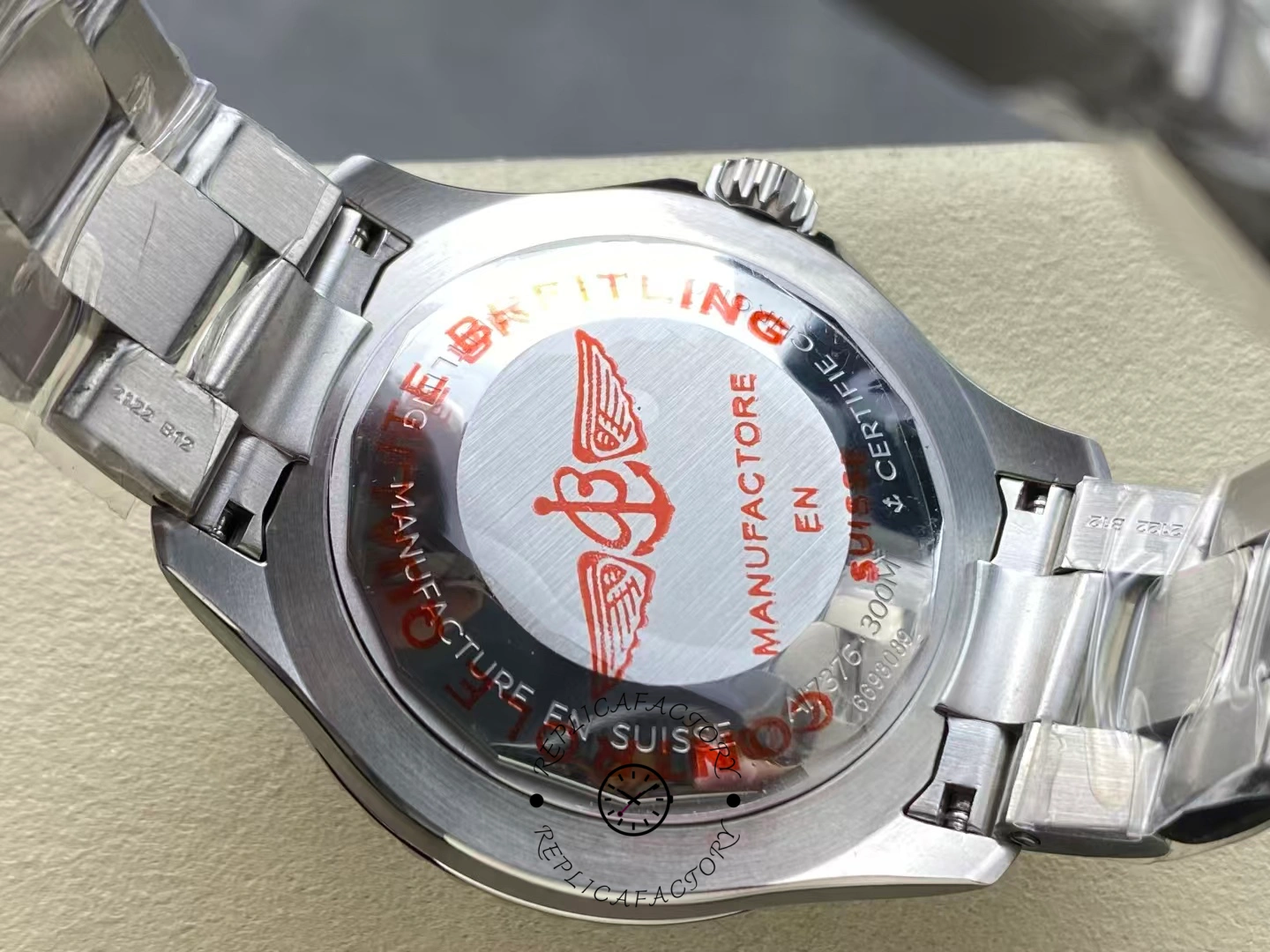 Caseback of Breitling Superocean 44 A17376A31L1A1 showing red winged logo engraving.