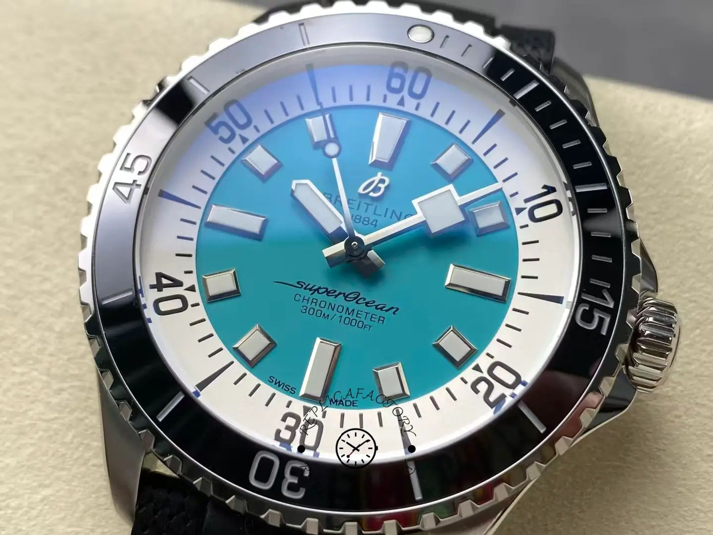 Close-up of Breitling Superocean 44 A17376211L2S1 turquoise dial and luminous markers.
