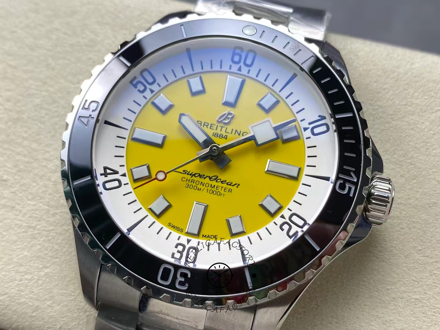 Close-up of Breitling Superocean 42 A17375211I1A1 yellow dial showing luminous hour markers.