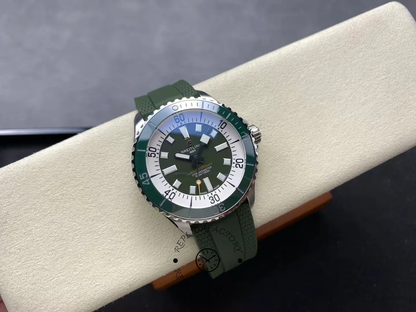 Straight-on shot of Breitling Superocean A17376A31L1S1 green dial diving watch.