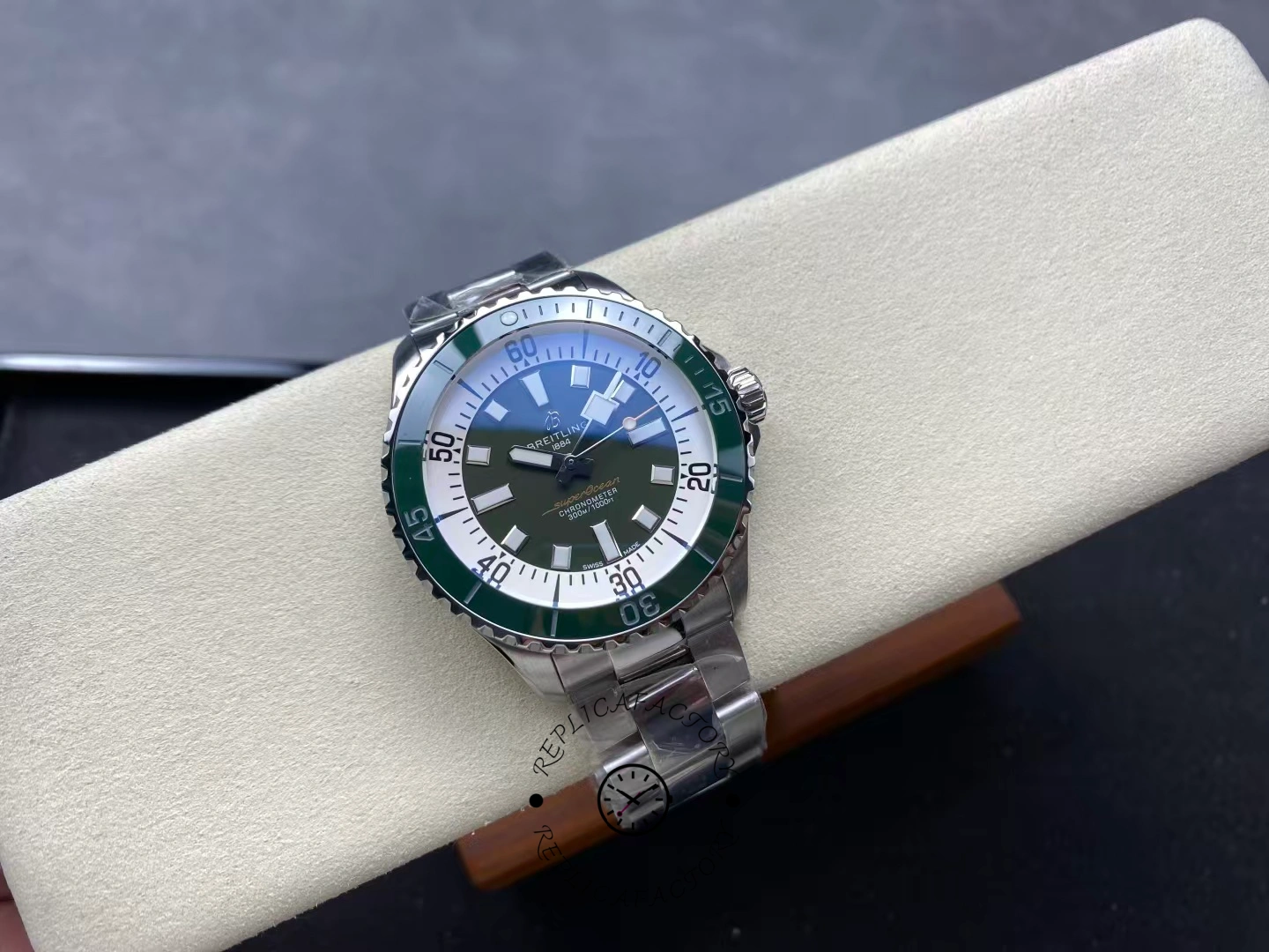 Top view of Breitling Superocean 44 A17376A31L1A1 green dial dive watch with steel bracelet.