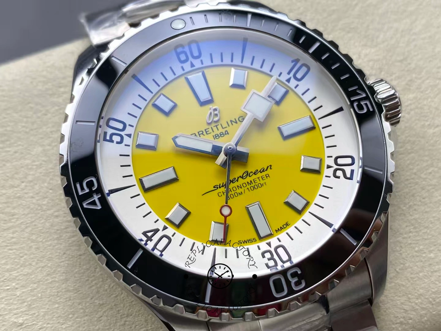 Macro shot of Breitling Superocean 42 A17375211I1A1 yellow dial and black bezel.