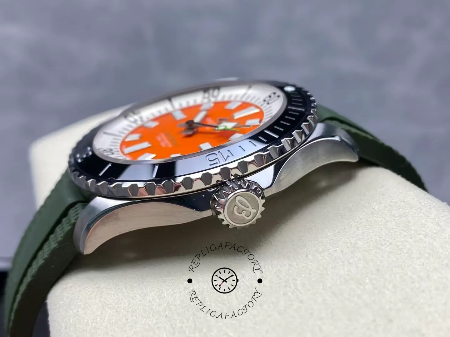 Side view of Breitling Superocean A173751A1O1S1 orange dial showing crown and bezel.