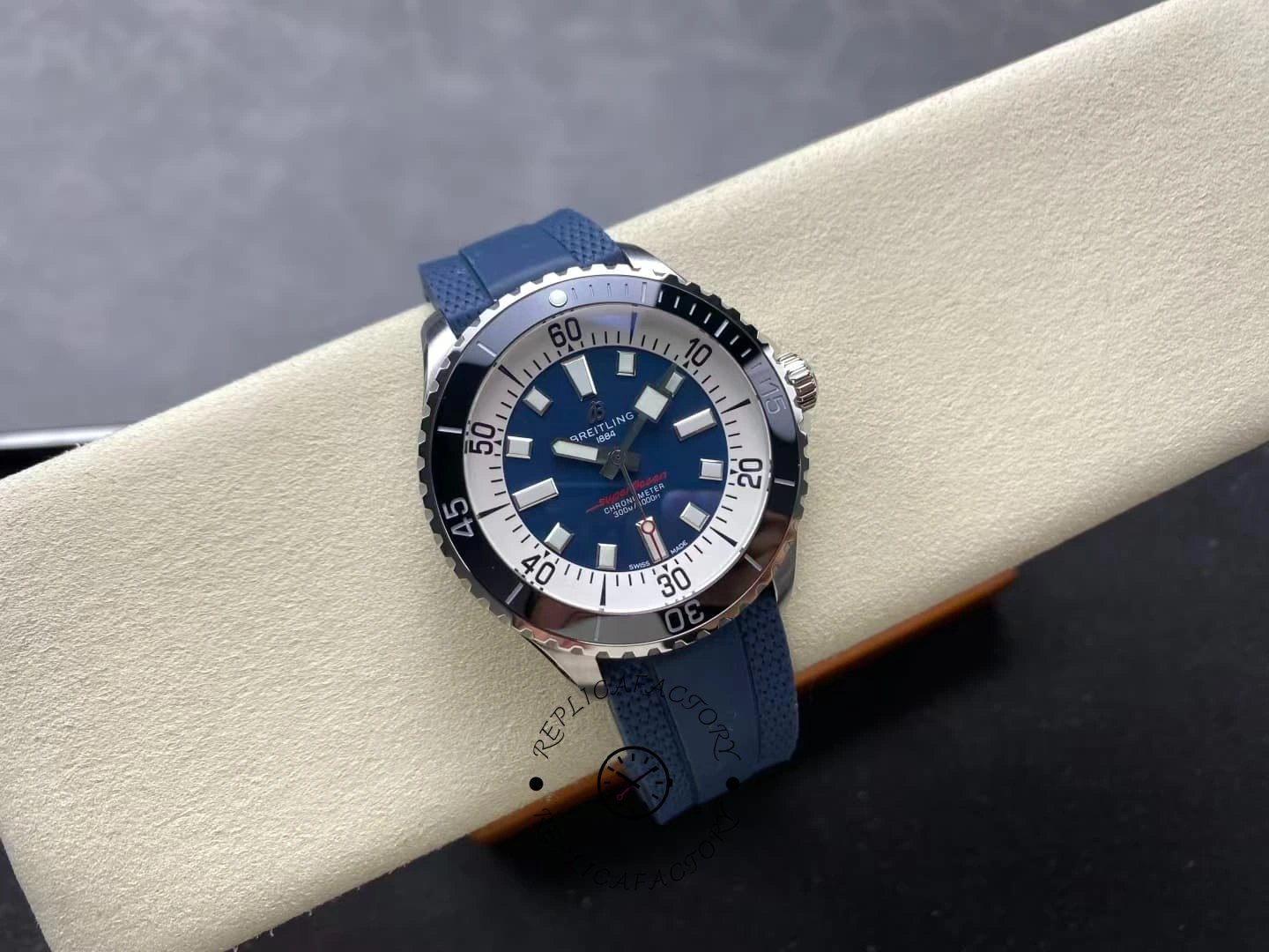 Front display of Breitling Superocean A17376211C1S1 blue dial on blue rubber strap.