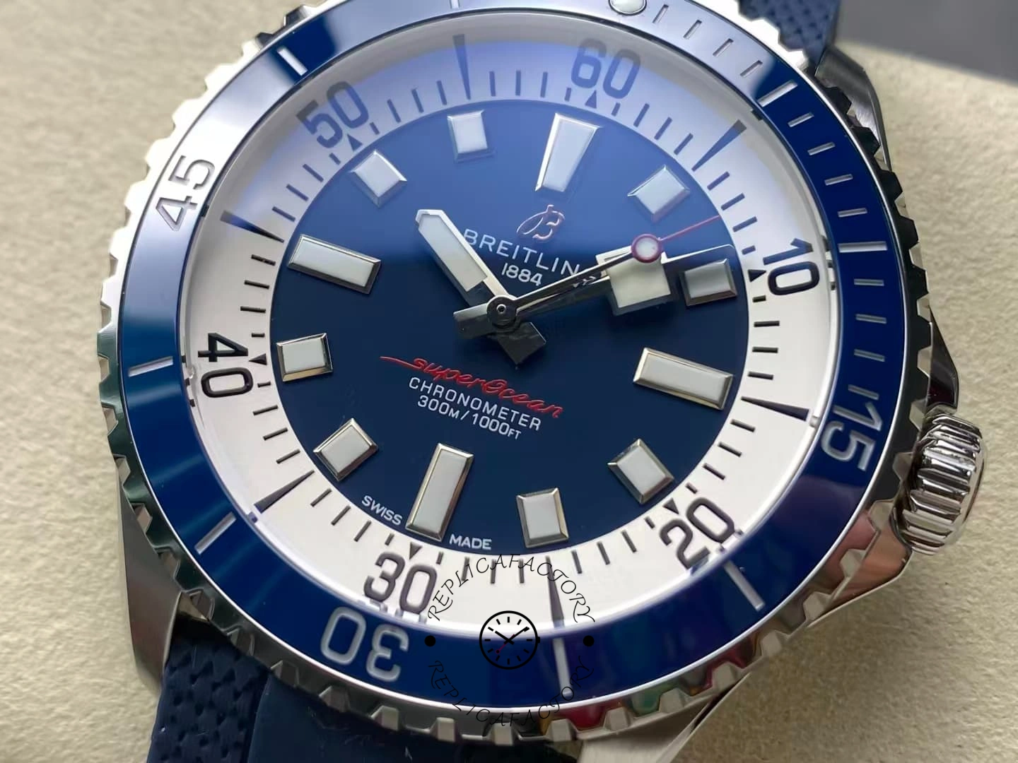 Close-up of Breitling Superocean A17375E71C1S1 blue ceramic bezel and dial.