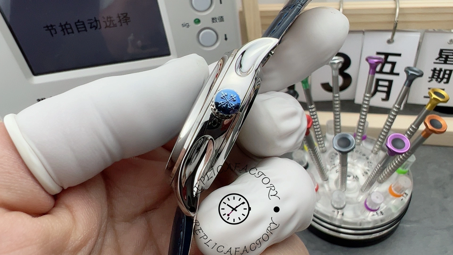 Crown-side view of the Patek Philippe 5140P-001 with engraved blue Calatrava crown cover.