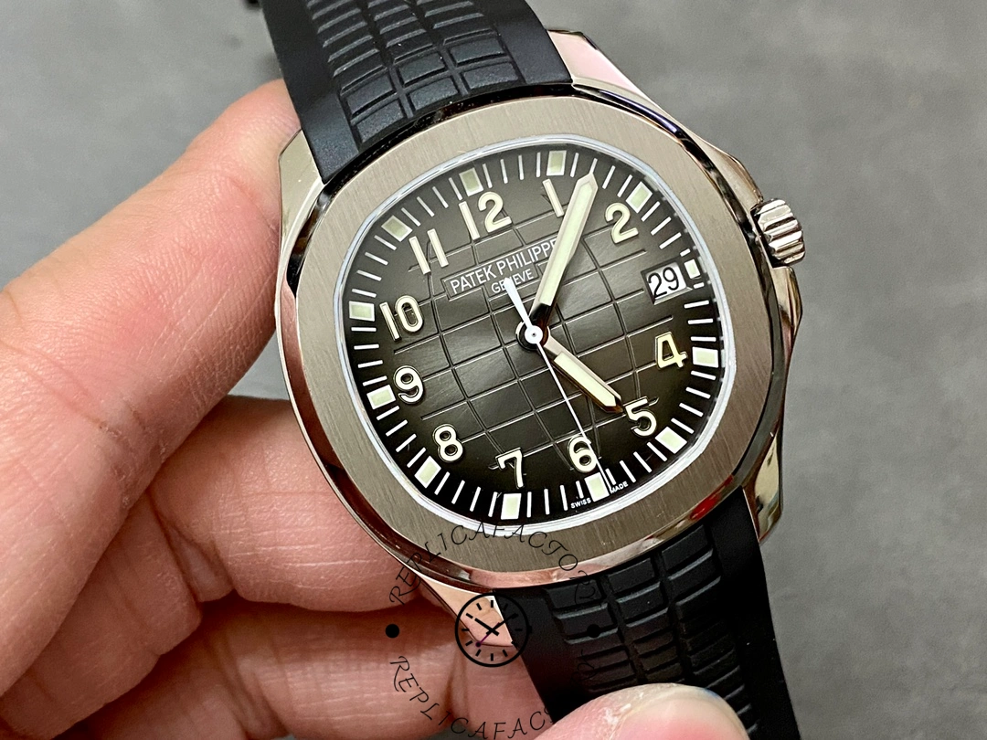 Angled view of the Patek Philippe Aquanaut 5167A-001 dial with luminous markers and brushed bezel.