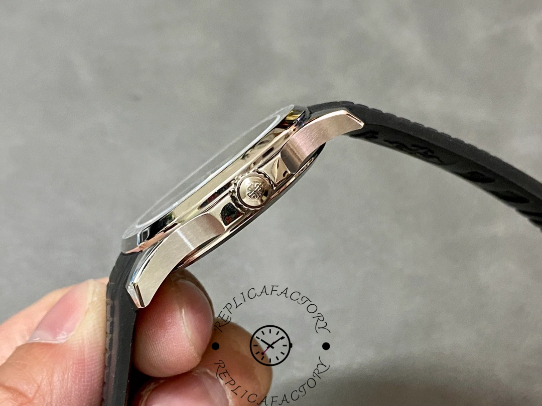 Crown-side view of the Patek Philippe Aquanaut 5167A-001 with engraved Calatrava cross crown.