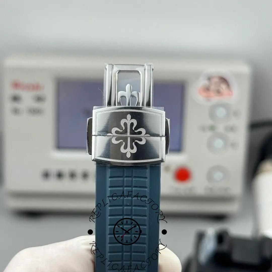 Close-up of the Patek Philippe Aquanaut 5164G-001 clasp with engraved Calatrava cross.