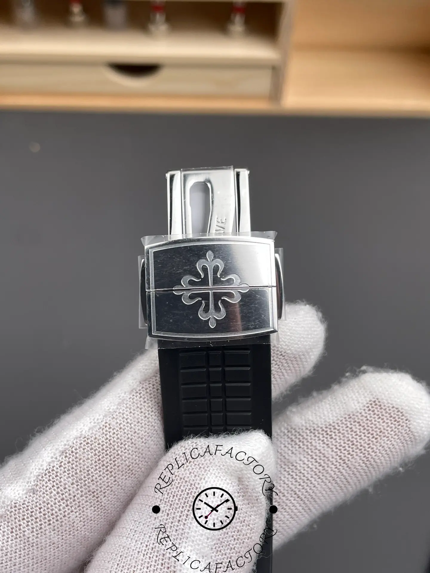 Clasp close-up of the Patek Philippe Aquanaut 5167A-001 with engraved buckle.