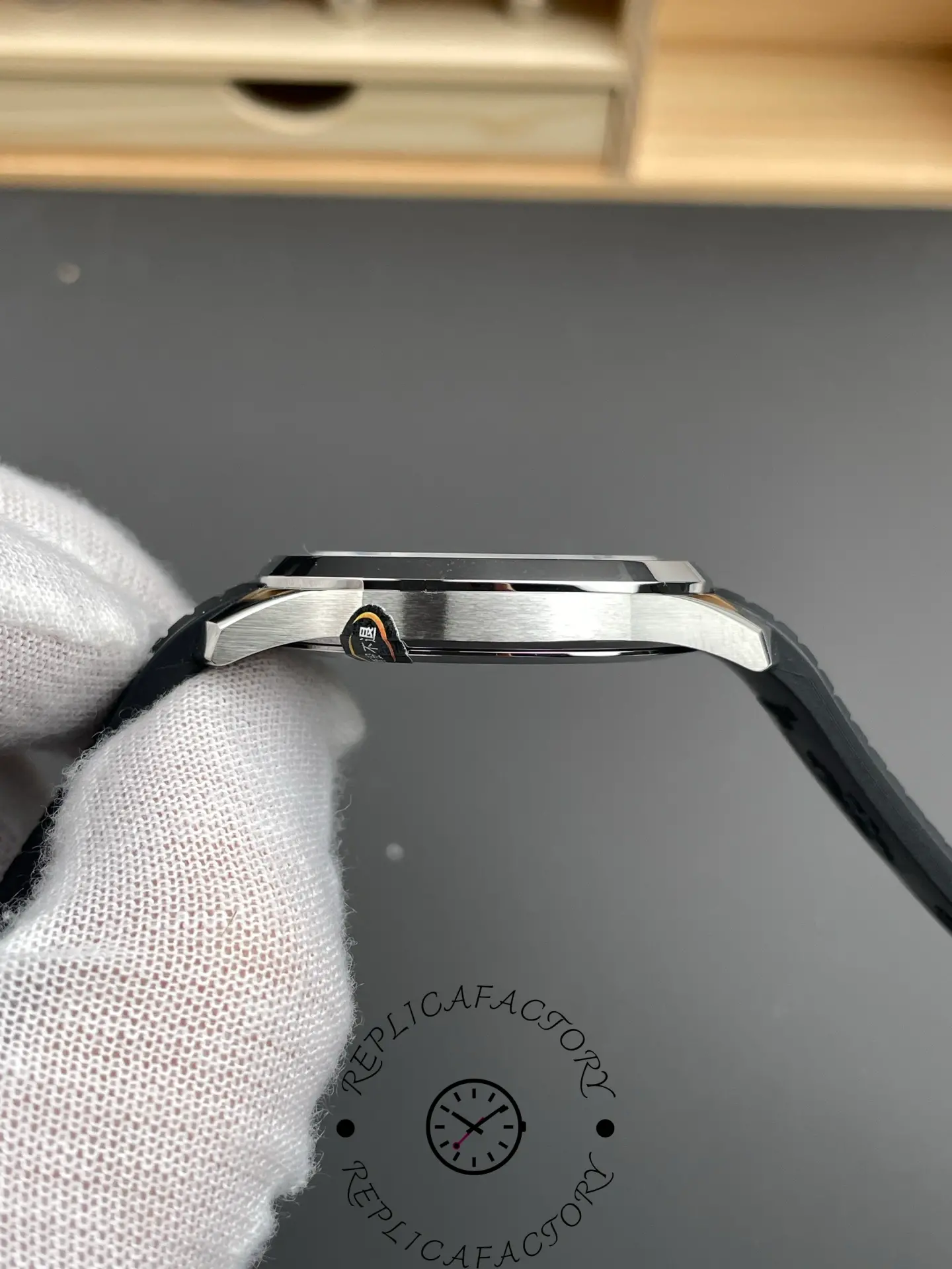 Side case image of the Patek Philippe Aquanaut 5167A-001 showing brushed finish.