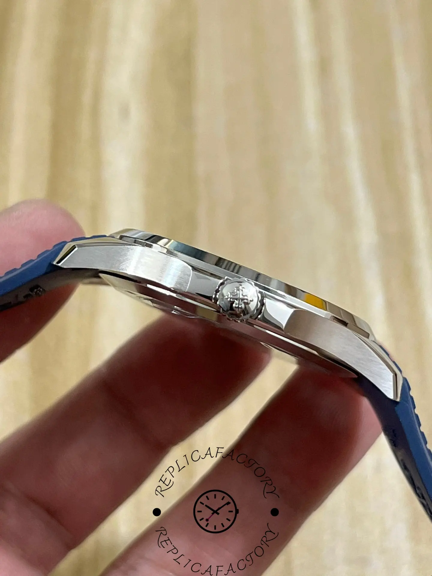 Side profile of the Patek Philippe Aquanaut 5164G-001 showing brushed case and crown design.