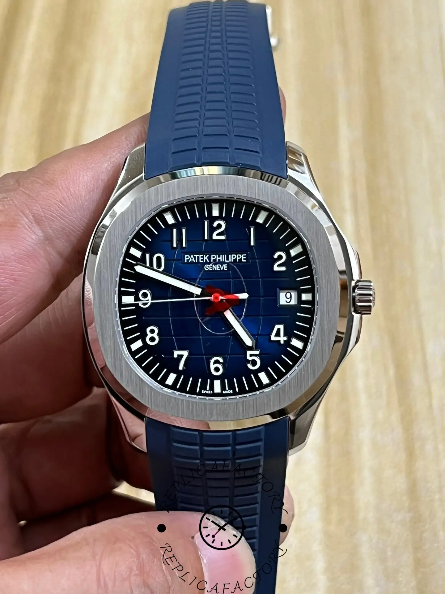Front view of the Patek Philippe Aquanaut 5164G-001 showing the blue dial and red seconds hand.