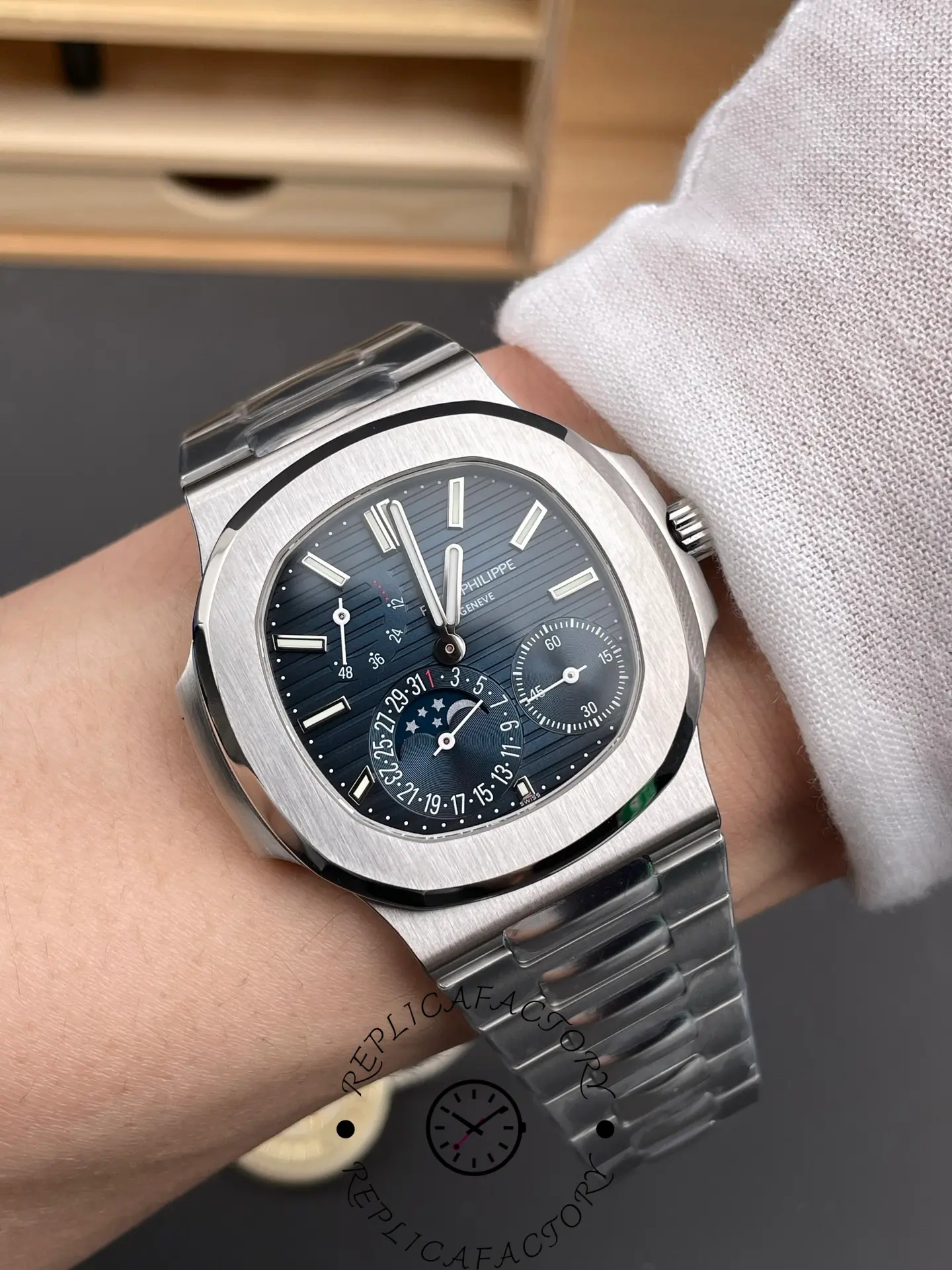 Wrist shot of the Patek Philippe Nautilus 5712/1A-001 with blue dial and stainless steel bracelet.