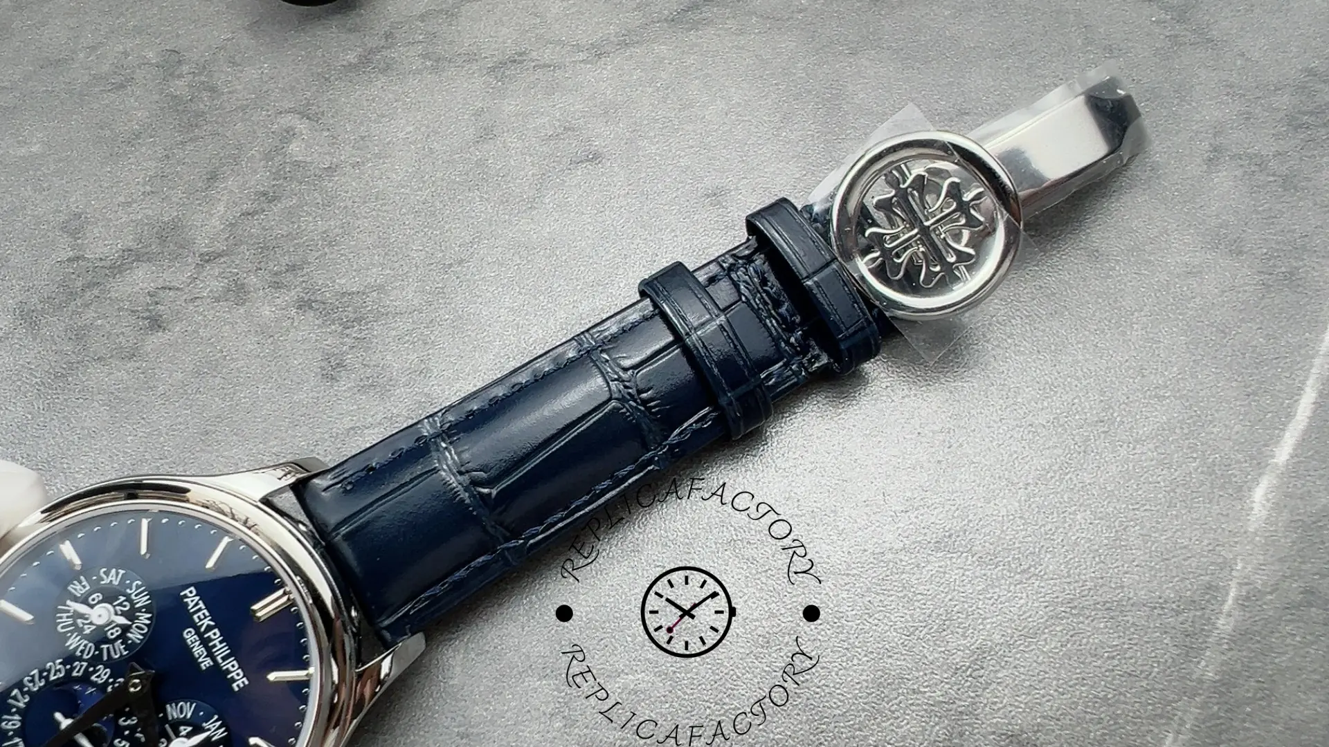 Close-up of the Patek Philippe 5140P-001 leather strap and Calatrava deployant clasp.