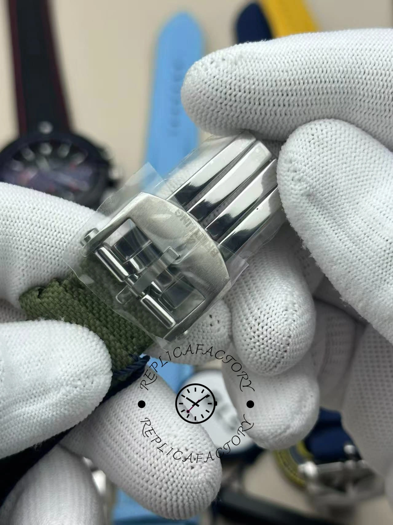 Buckle view of Breitling Avenger B01 Chronograph 44 AB0147101L1X1 with polished clasp and green strap.