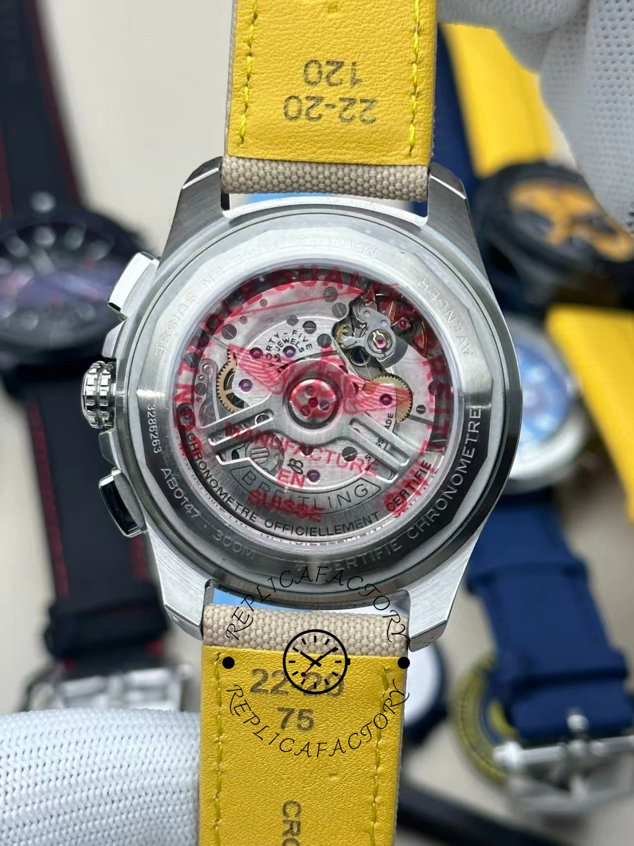 Rear movement view of Breitling Avenger B01 Chronograph 44 AB0147101A1X1 highlighting gears and rotor engraving.