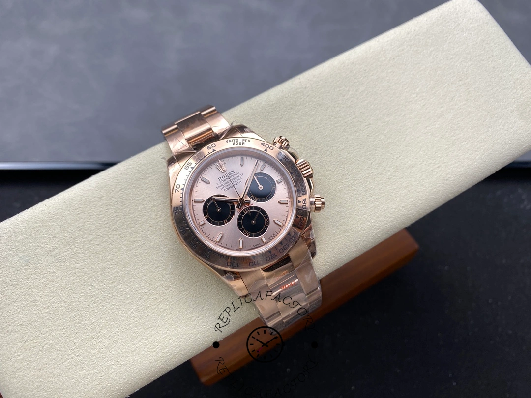 Full view of Rolex Daytona 126505 on cushion displaying Everose gold finish and Sundust dial.