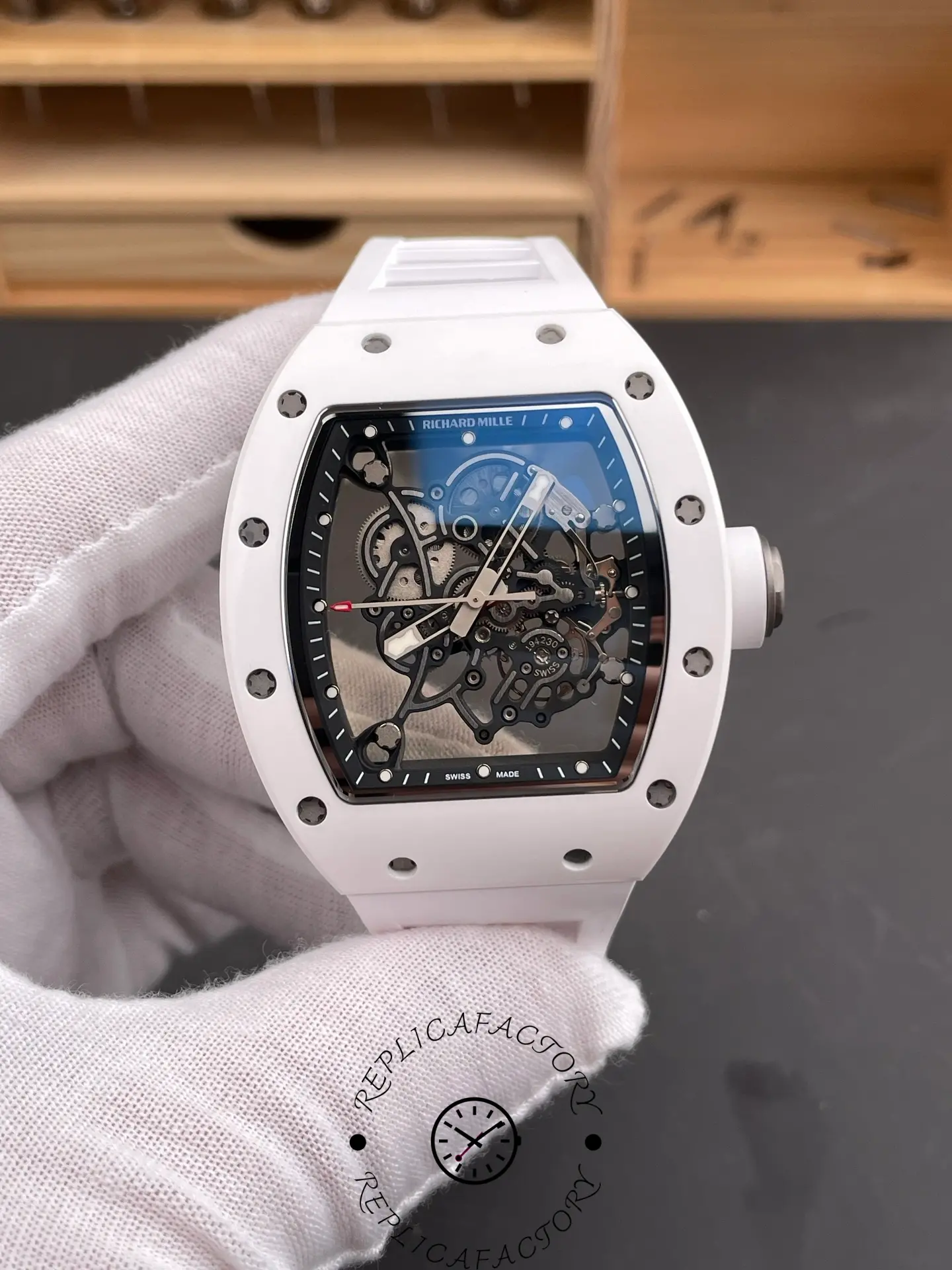 Handheld front view of Richard Mille RM055 RMUL2 showing transparent skeleton movement.
