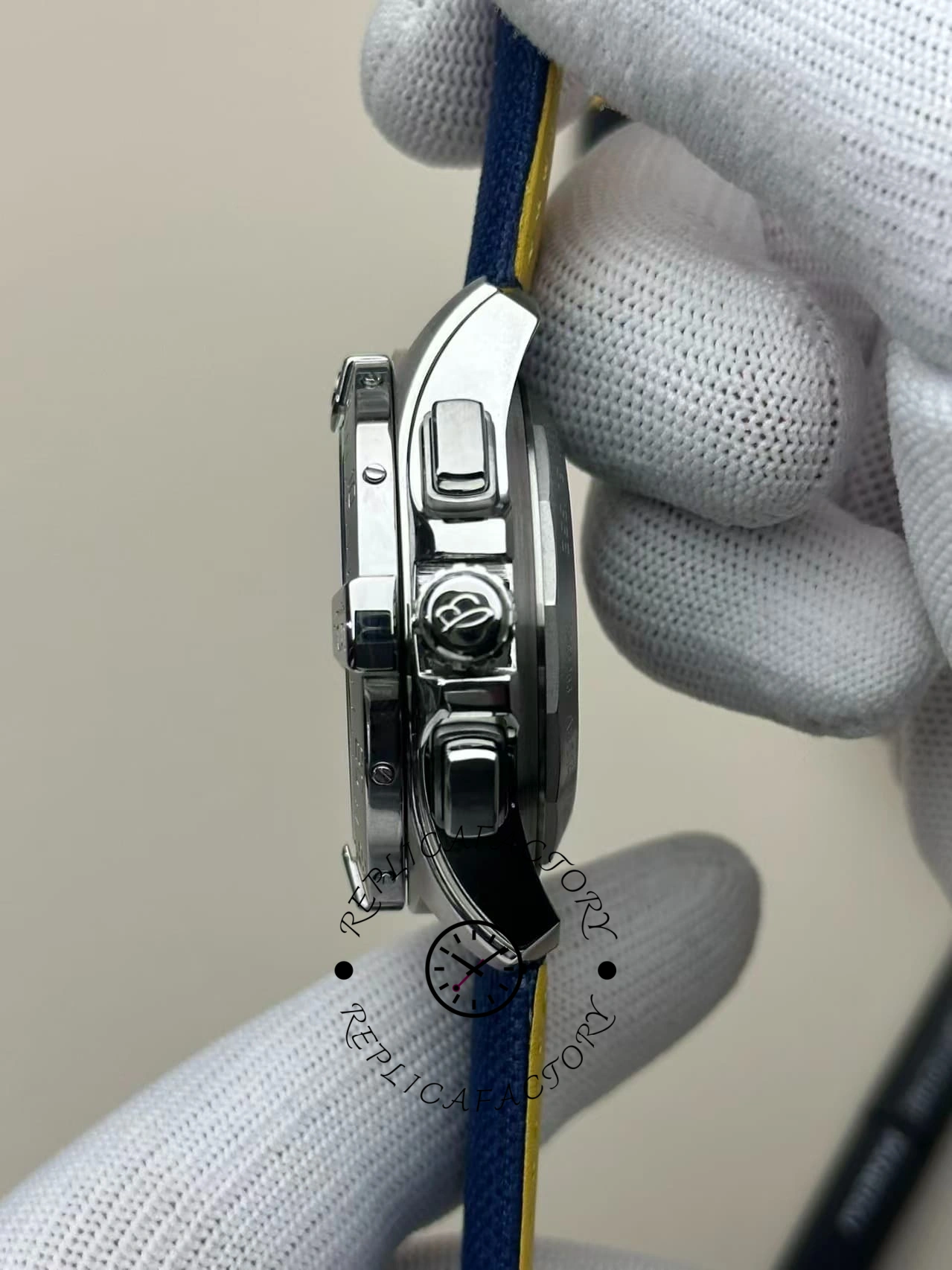 Close-up of the side crown and pushers on the Breitling Avenger B01 Chronograph 44 AB0147101C1X1.