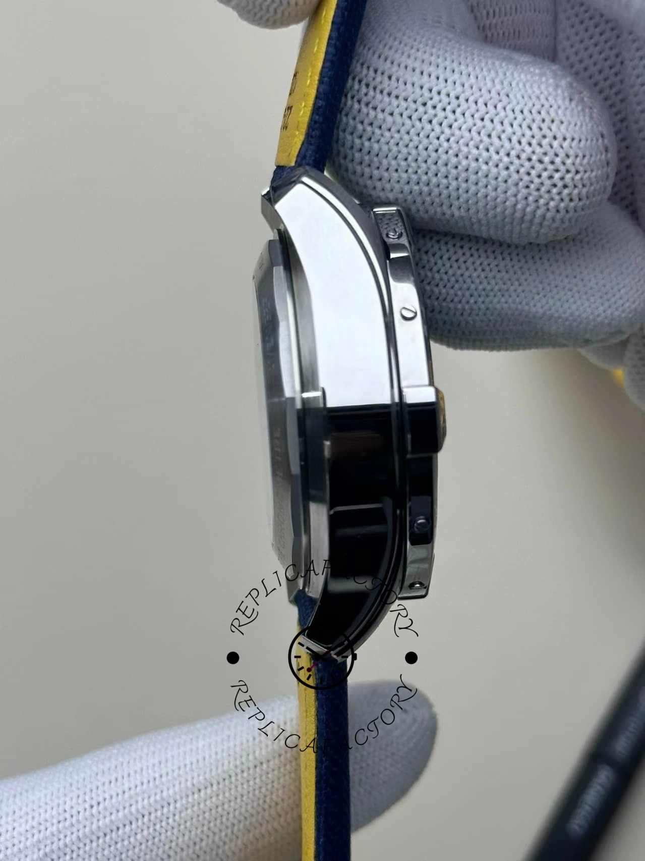 Side view of Breitling Avenger B01 Chronograph 44 AB0147101C1X1 showing polished case and pushers.