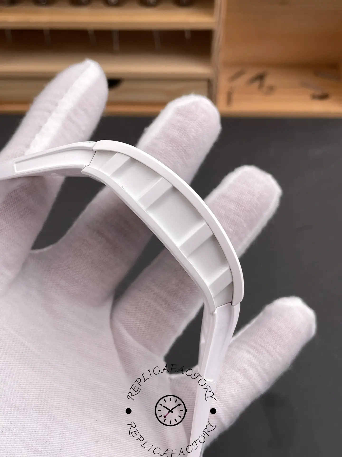 Side profile of Richard Mille RM055 RMUL2 showing curved white case design.