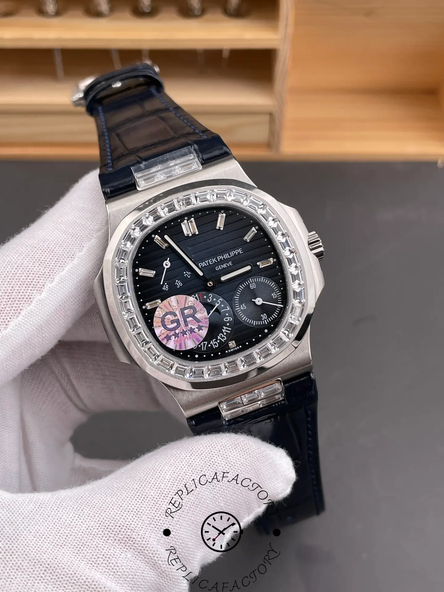 Angled front view of Patek Philippe 5724G-001 highlighting baguette bezel and subdials.