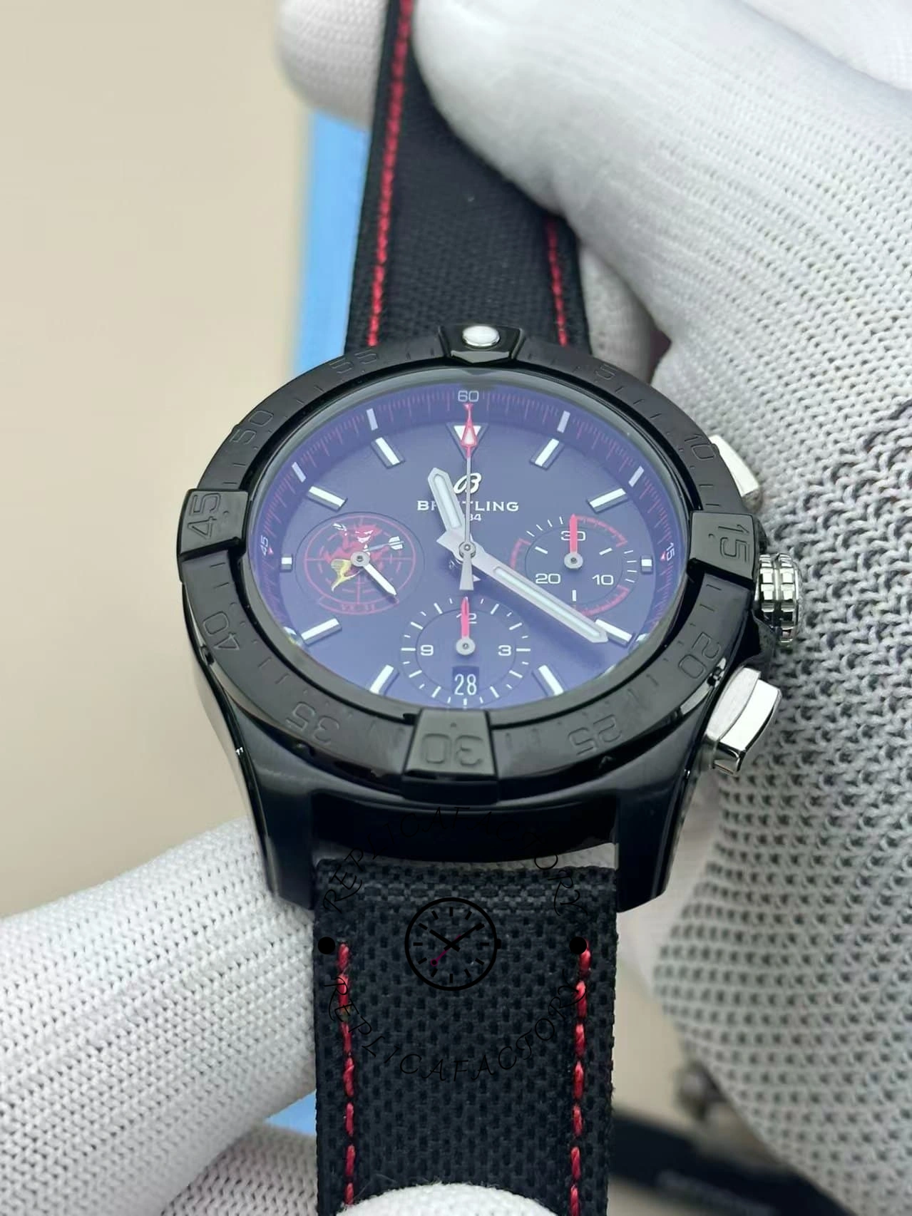 Front angled view of Breitling Avenger B01 SB01473A1B1X1 with blue-tinted glass and fabric strap.