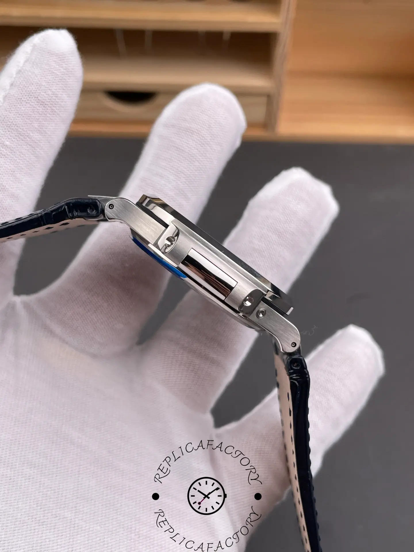 Side profile of Patek Philippe 5724G-001 showing polished case and leather strap.