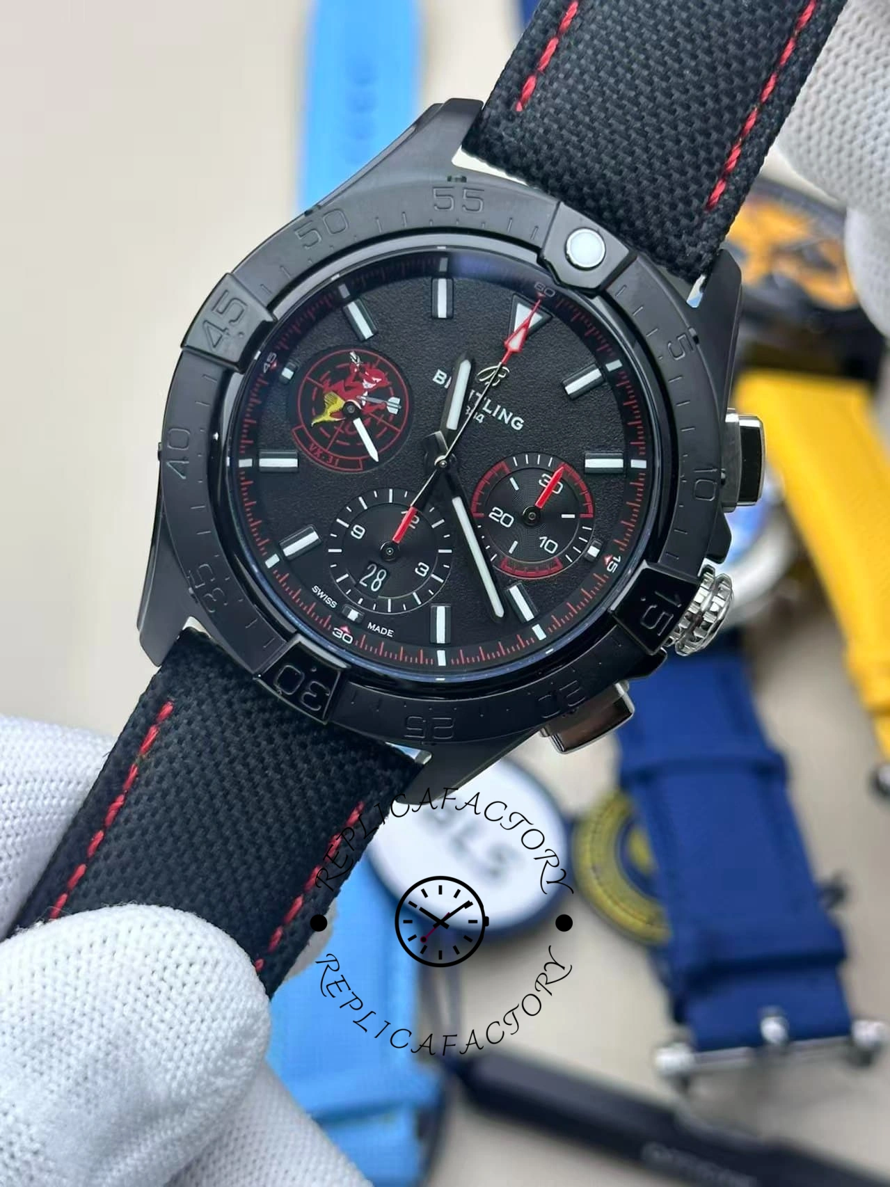 Close-up of Breitling Avenger B01 SB01473A1B1X1 black dial with red-accent chronograph subdials.