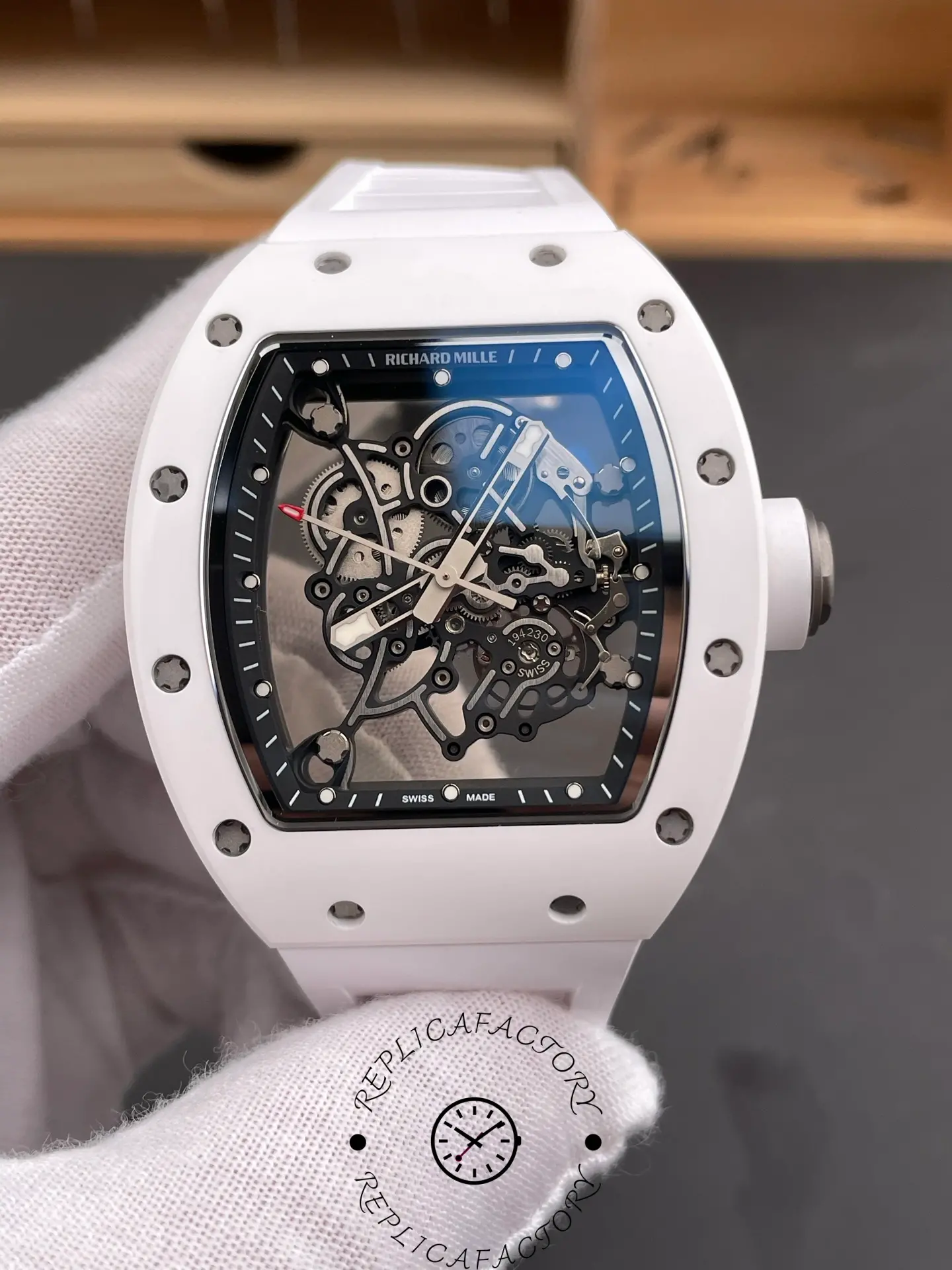 Close-up of Richard Mille RM055 RMUL2 showing inner movement and white ceramic case.