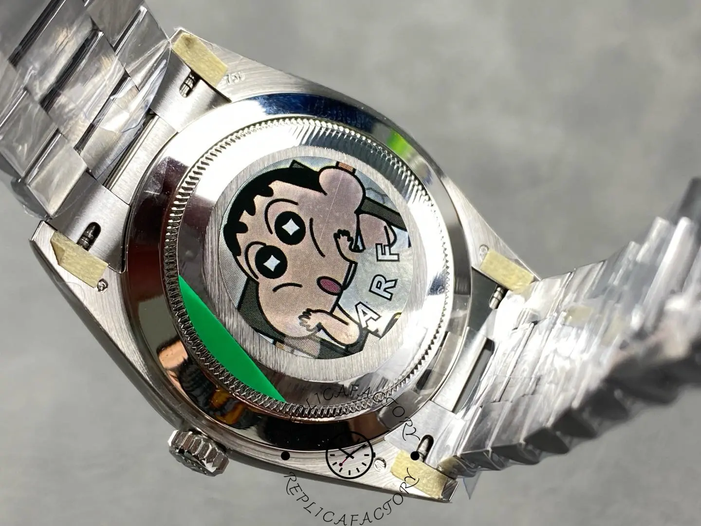 Back view of Rolex Day-Date 228239 showing caseback with protective sticker.