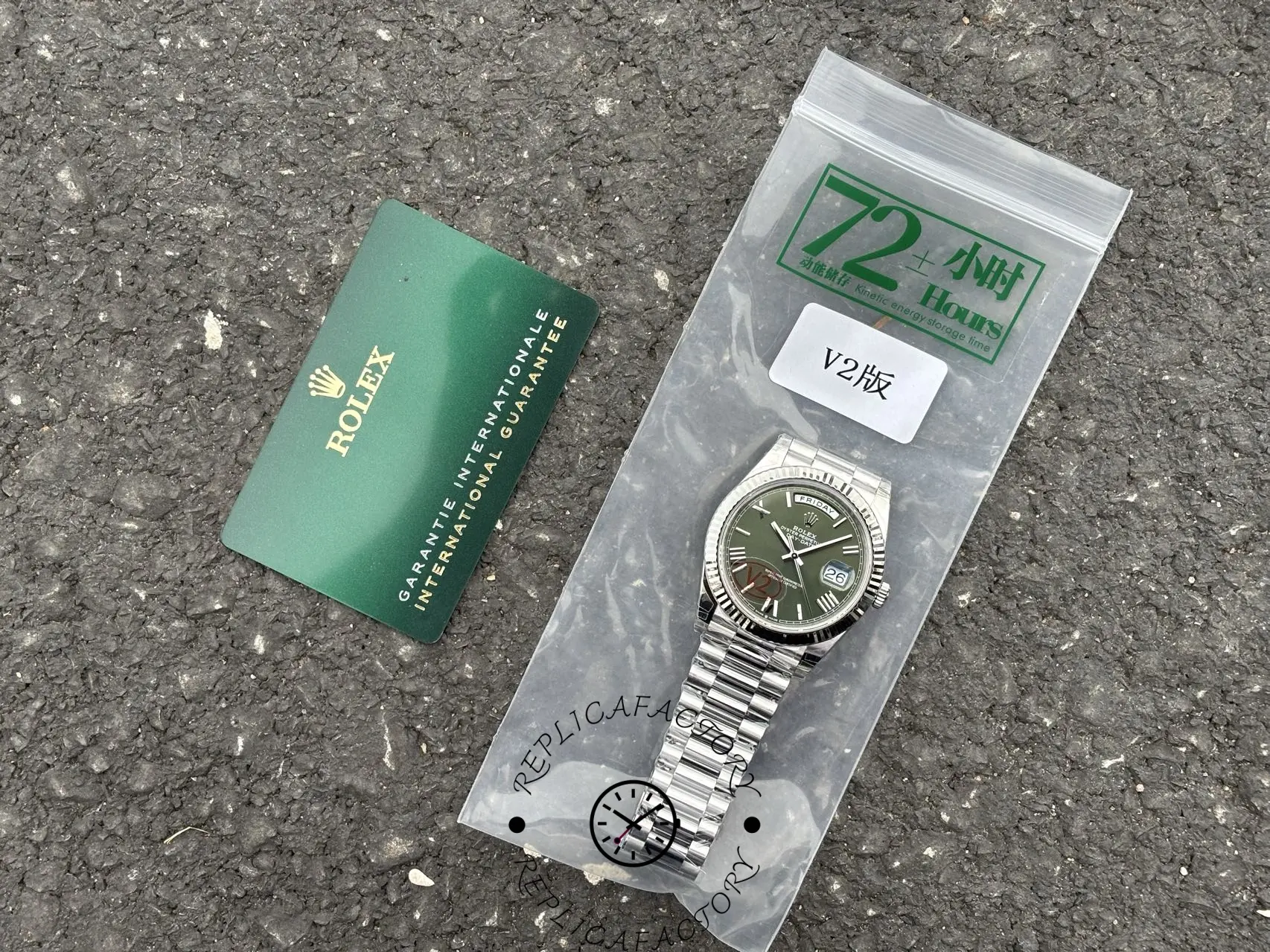 Full set image of Rolex Day-Date 228239 with green Roman dial, sealed packaging, and guarantee card.