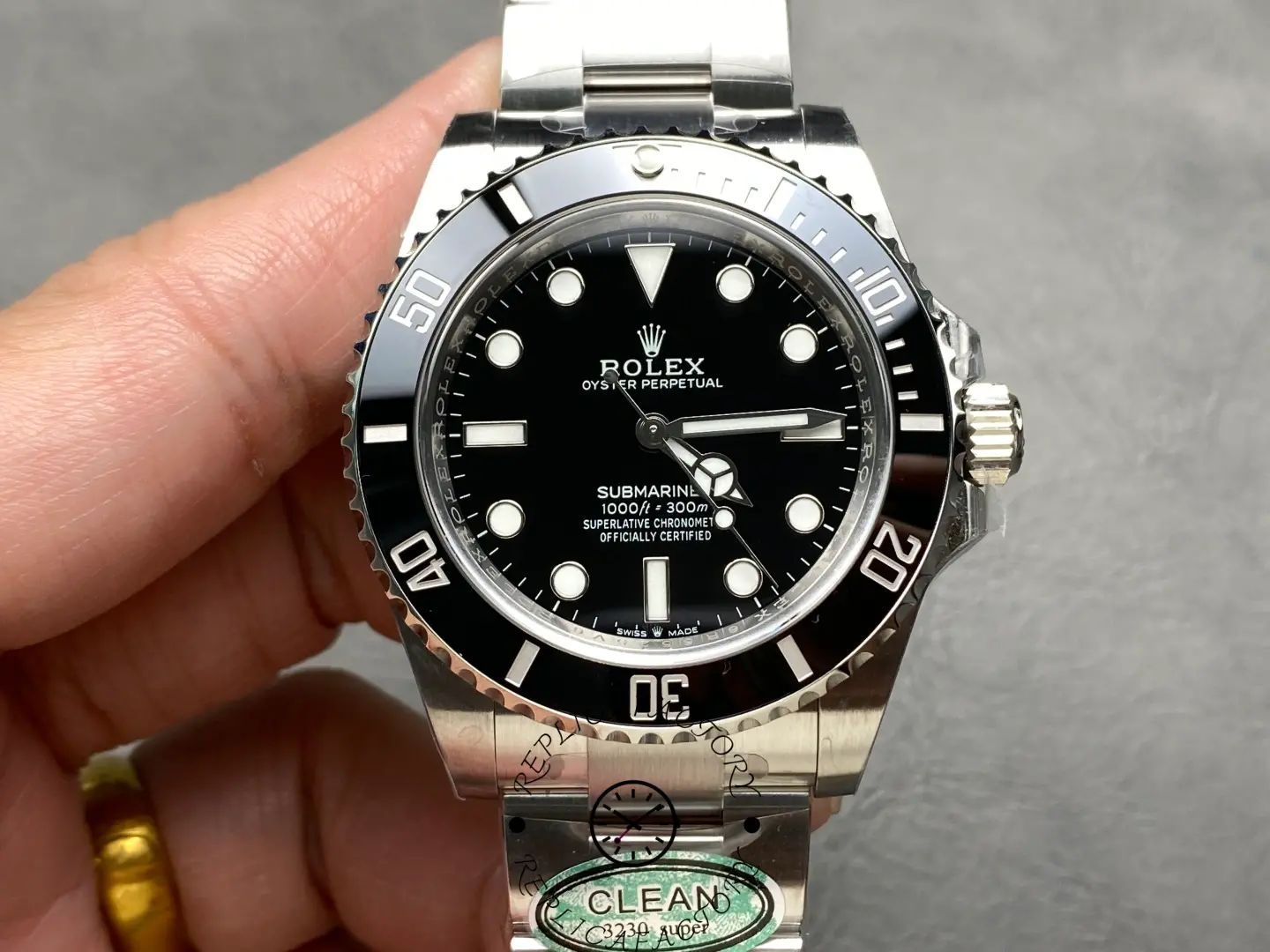 Close-up of the Rolex Submariner 124060 dial with luminous hour markers.