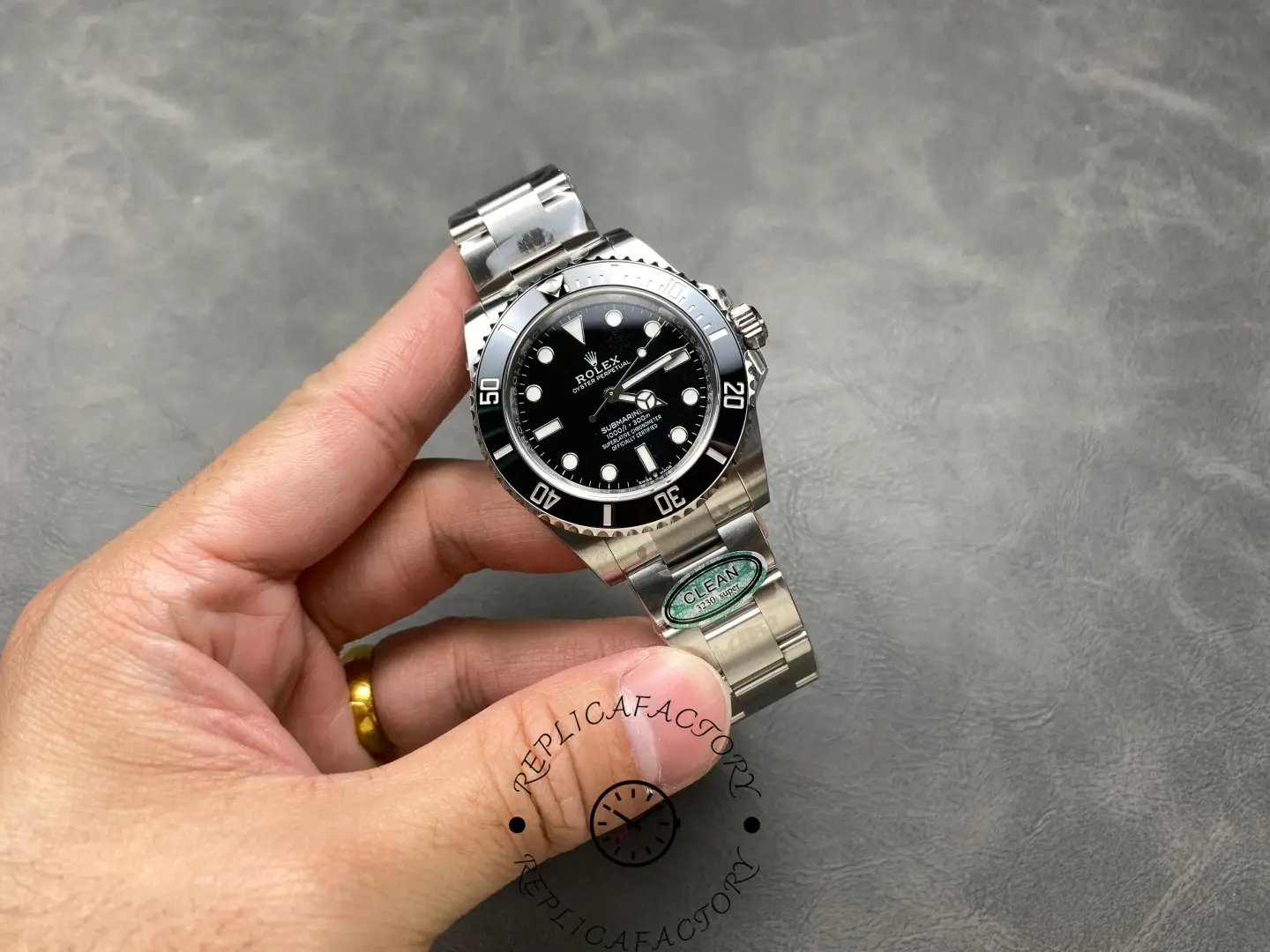 Full-hand view of the Rolex Submariner 124060 revealing bracelet and dial.