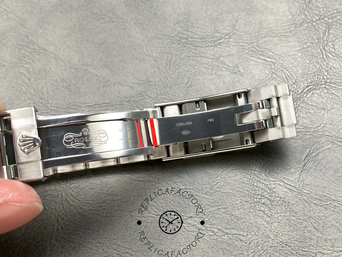 Inside view of the Rolex Submariner 124060 clasp with engraved branding.