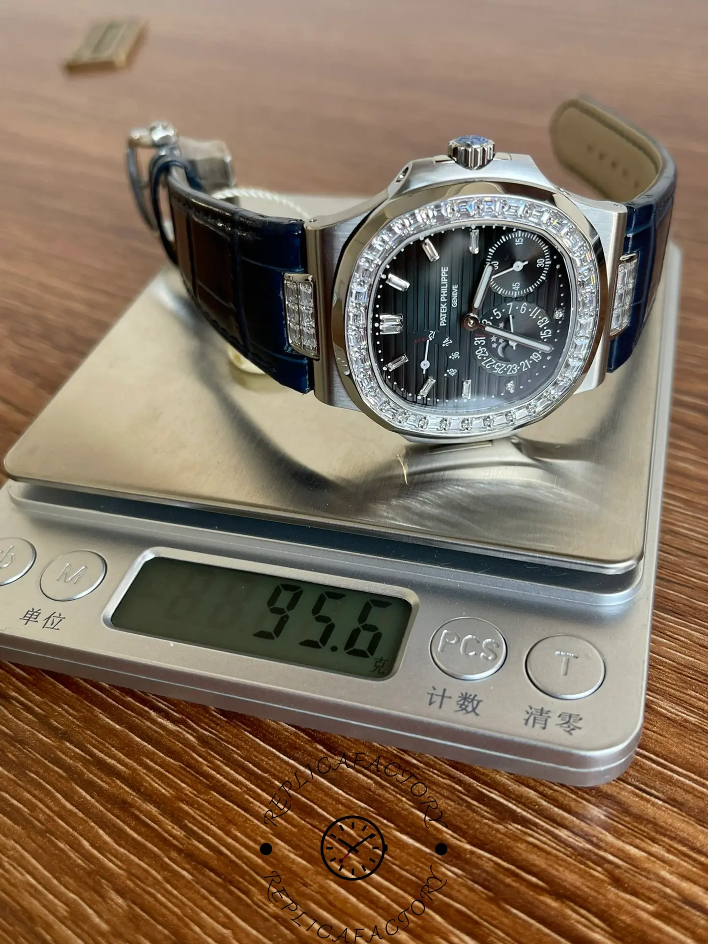 Patek Philippe 5724G-001 placed on scale showing watch weight measurement.