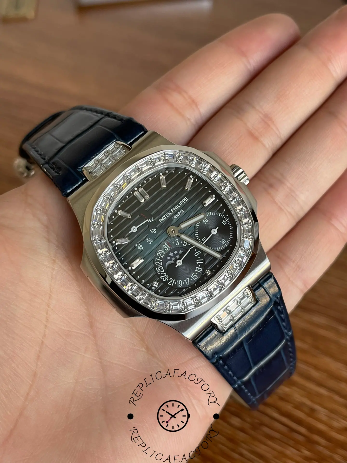 Perspective view of Patek Philippe 5724G-001 showing moon phase subdial and polished case.