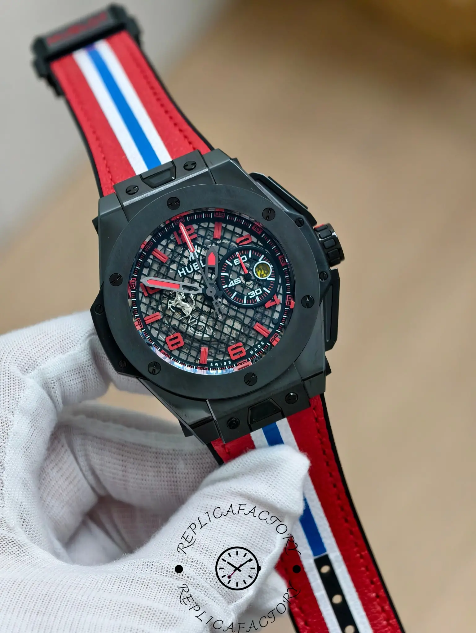 Angled view of Hublot Big Bang 401.CX.1123.VR with red accents and open-worked dial.
