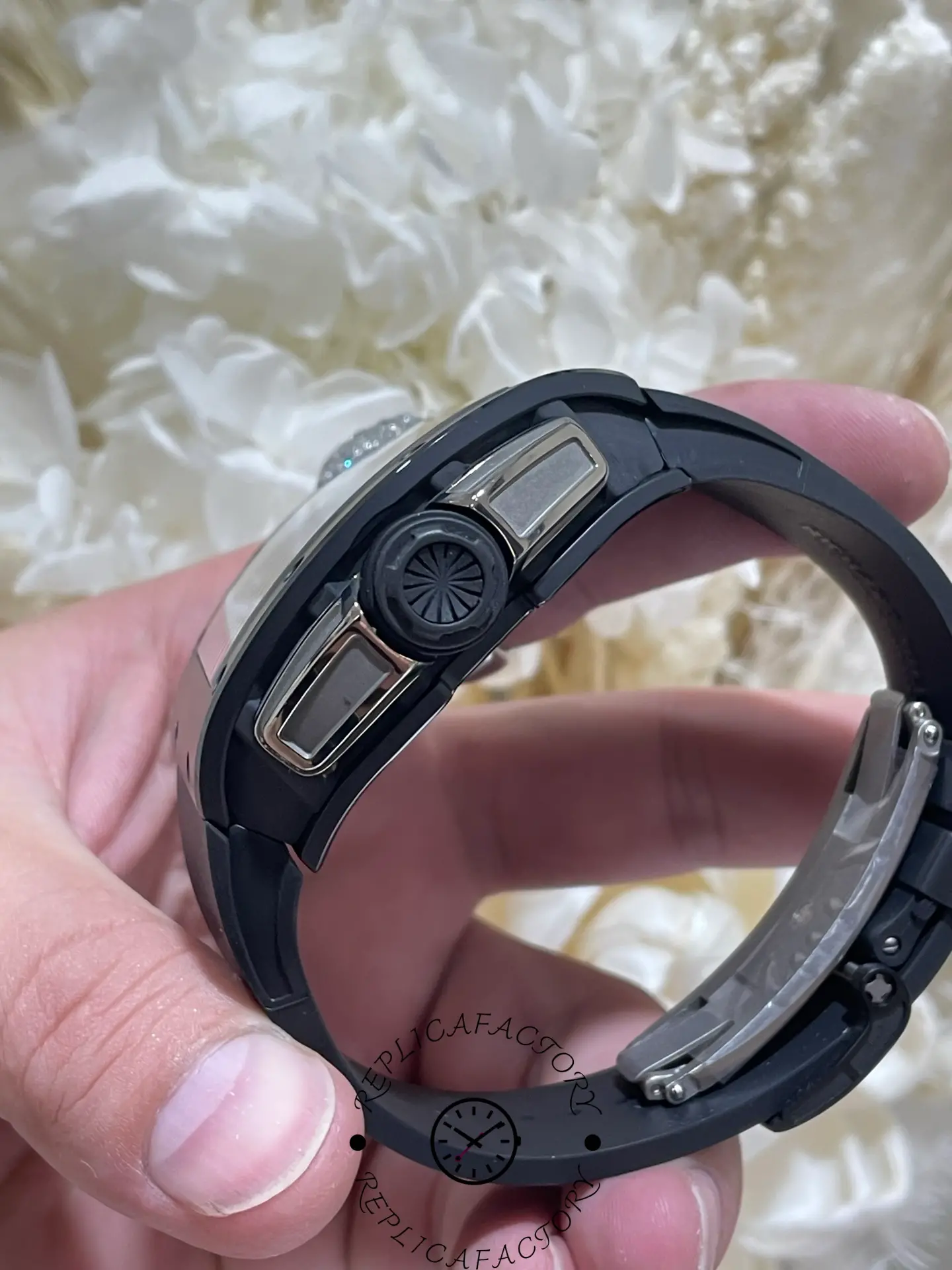 Side view of the RM61-01 replica crown with rubber protection detail.