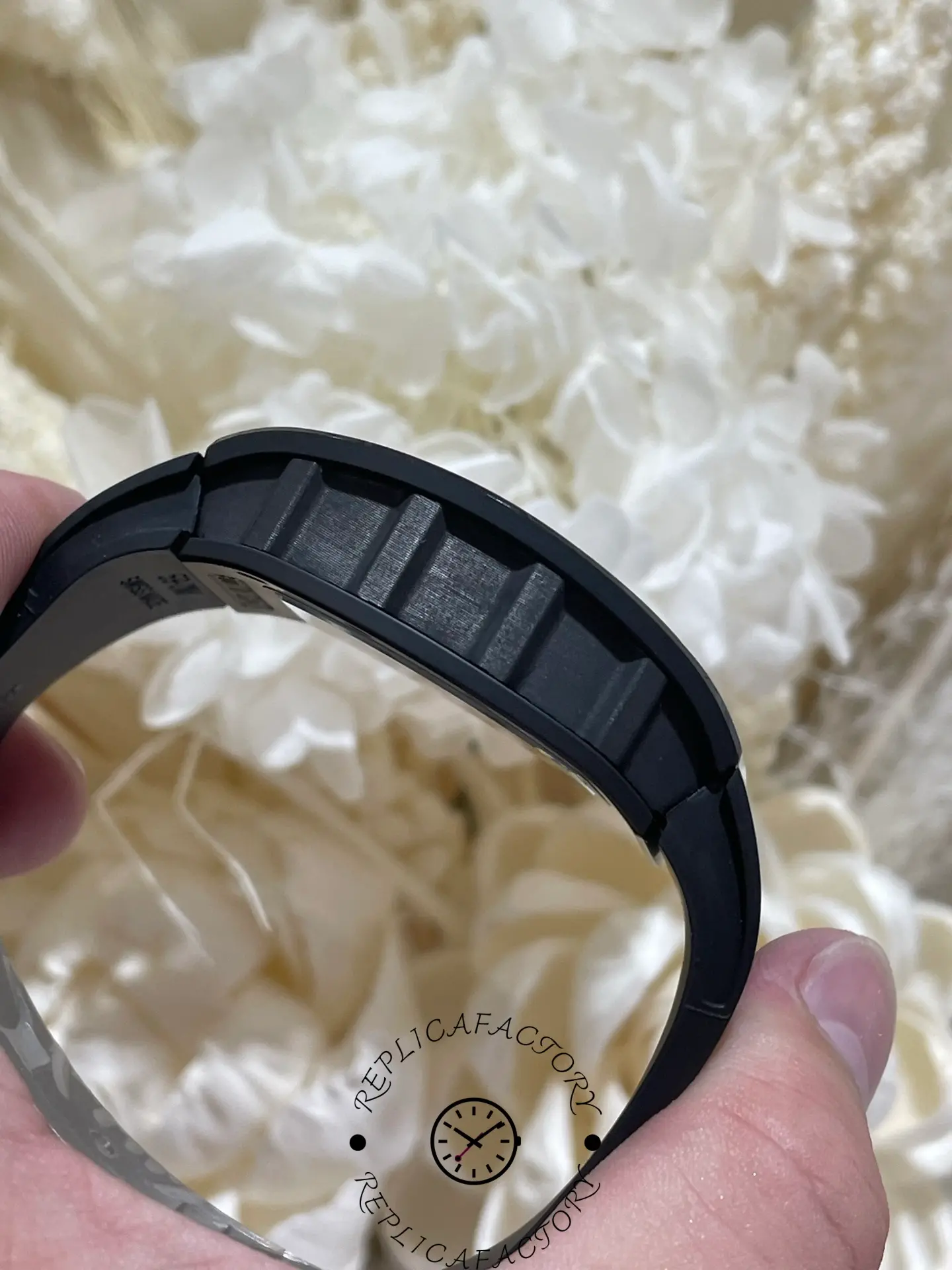 Case side of the RM61-01 replica showing ceramic structure and layered edges.