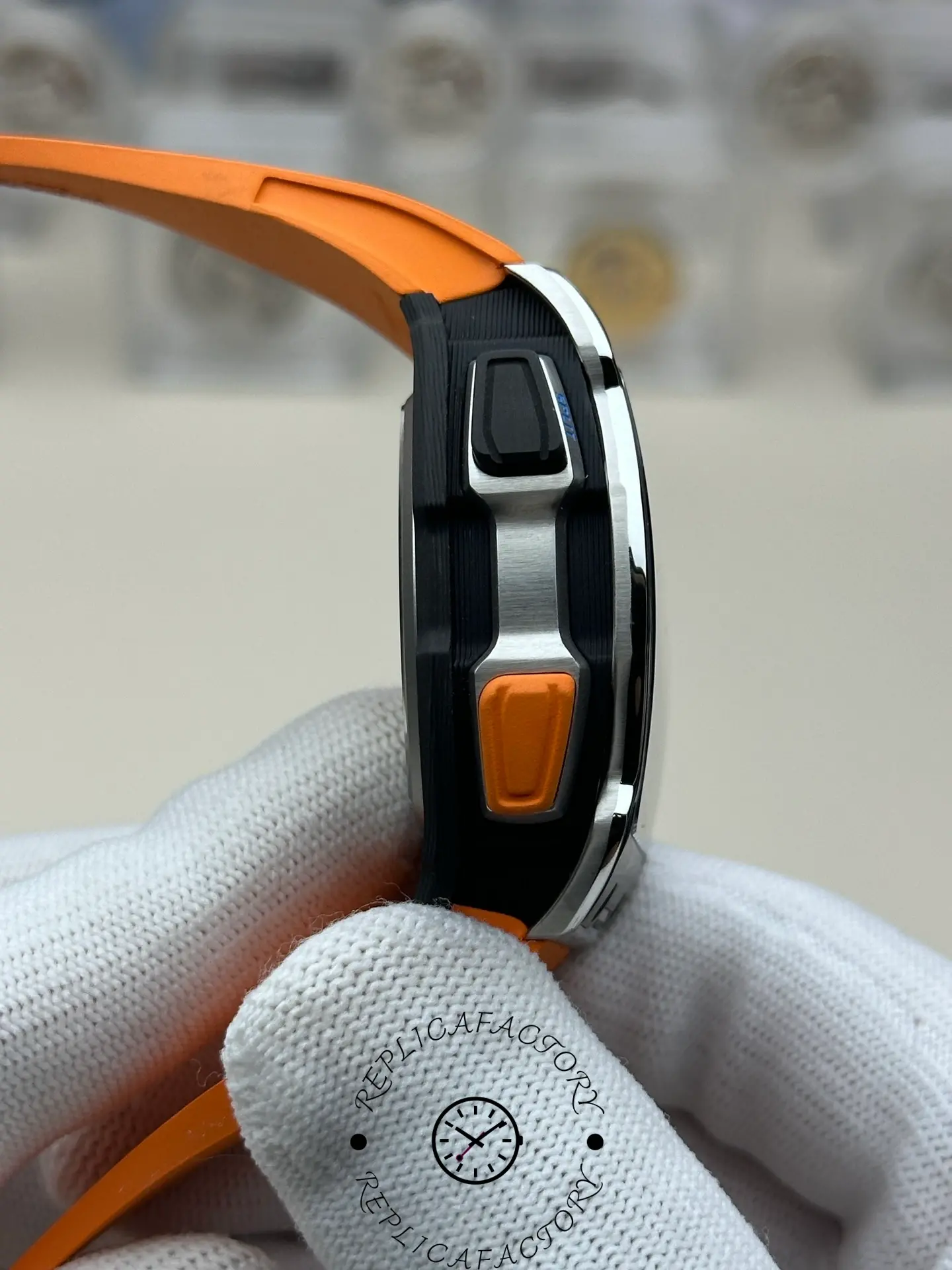 Side pusher view of Richard Mille RM 65-01 replica with orange function button.