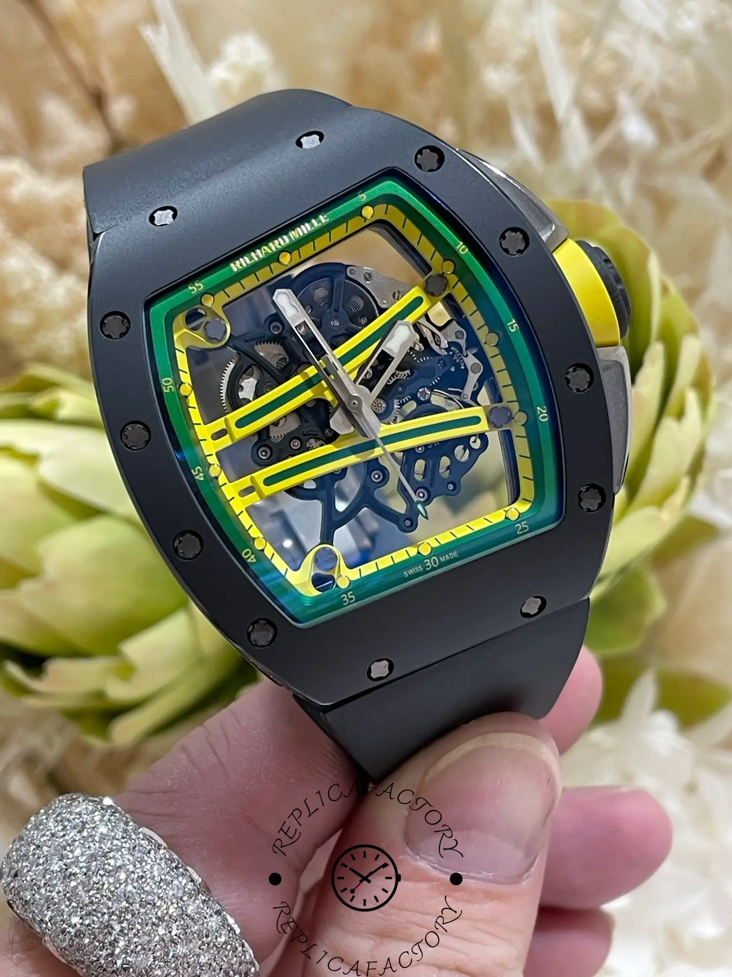 Close-up of RM 061-01 replica dial with cross-shaped yellow bridges and open gears.