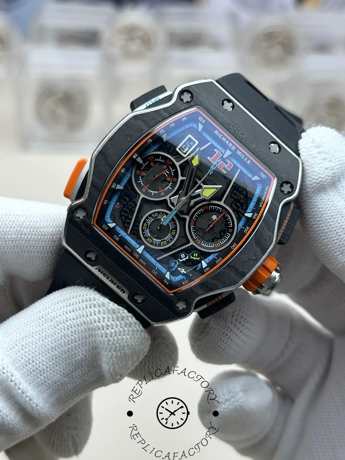 Handheld RM 65-01 replica showing luminous skeleton hands and chronograph layout.