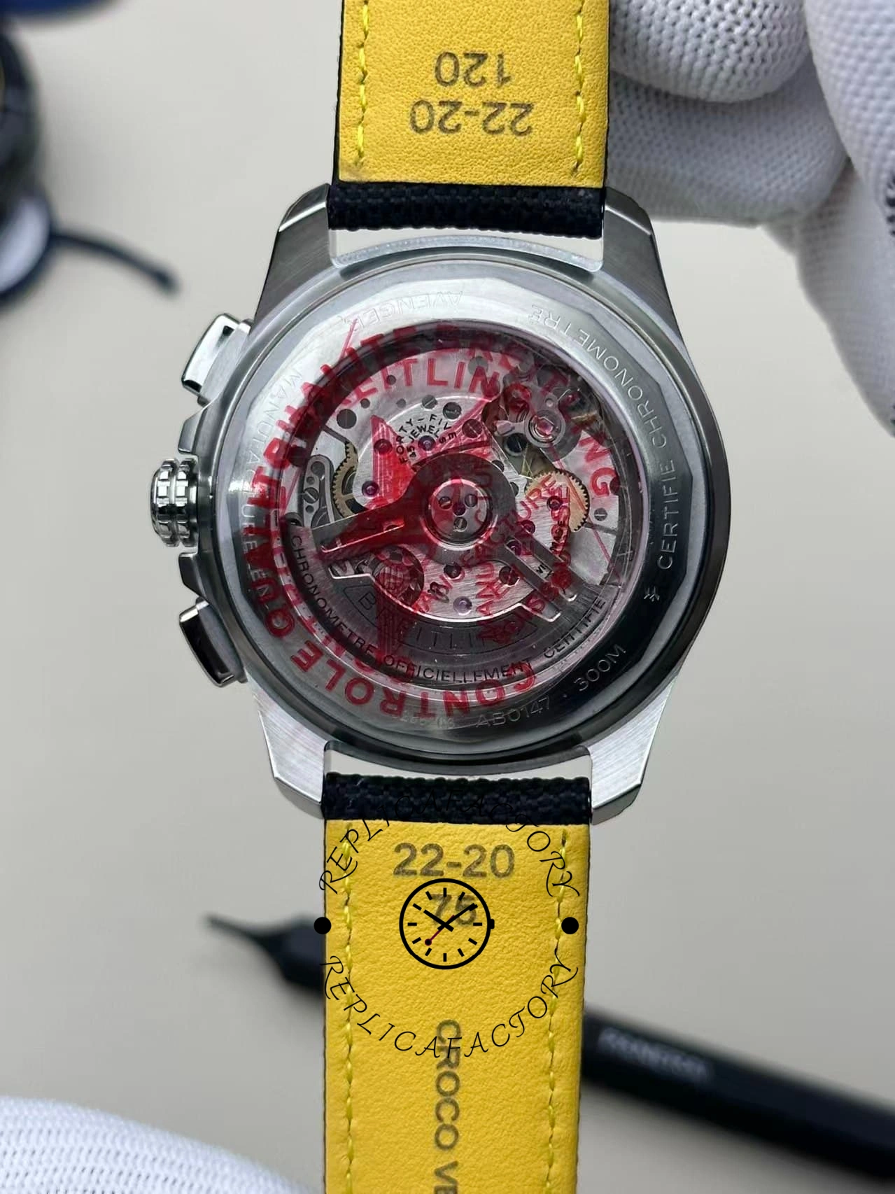 Full view of the Breitling Avenger B01 AB0146101B1X1 caseback and yellow inner leather strap.